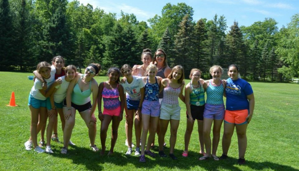 Campers outside playing field games