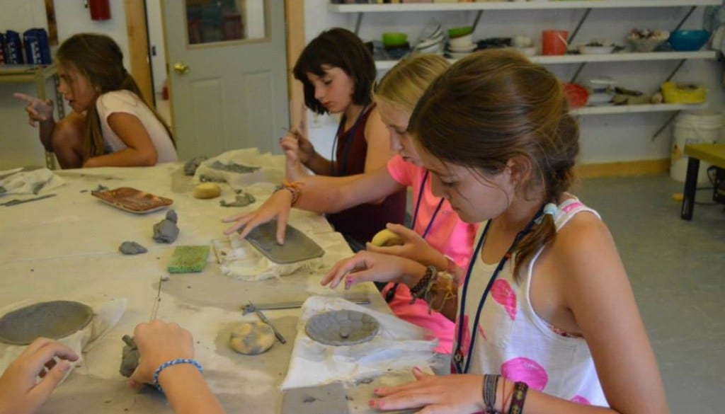 Campers playing with clay