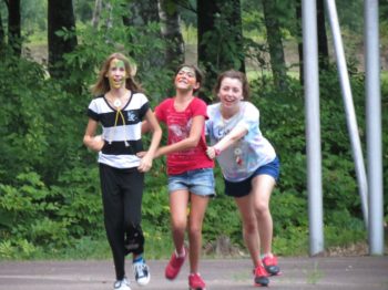 Excited campers running to join their new WeHaKee friends.