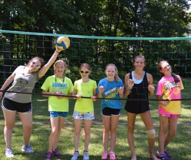 Campers playing volleyball