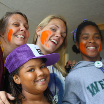 Campers with painted faces.