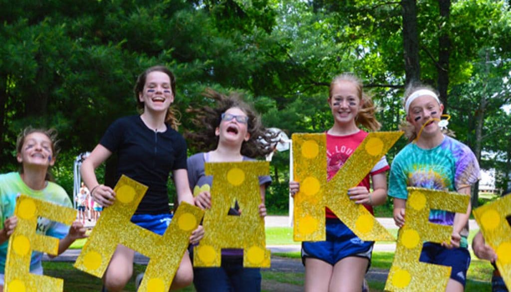 Campers at Girls Camp jumping for joy to be at WeHaKee Camp for Girls
