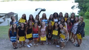 Campers holding their certificates from WeHaKee Camp for Girls.