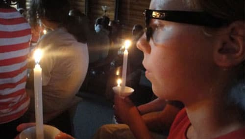 Candles at a ceremony hosted at WeHaKee Camp for Girls. All faiths are welcome at WeHaKee Camp for Girls