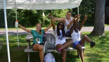 WeHaKee Camp for Girls staff members posing at a picnic table.