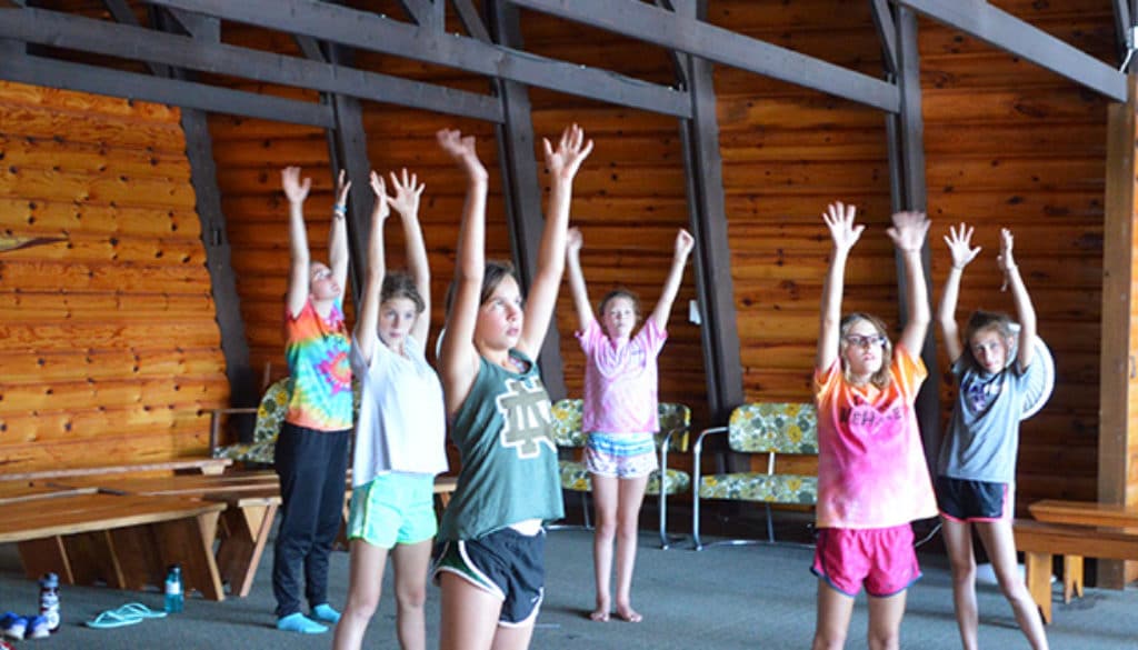 WeHaKee Camp for Girls Campers stretching.