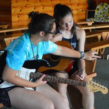 Learning Guitar at Girls Camp Violin, flute, piano, your voice, whatever your instrument is bring it to WeHaKee Camp for Girls