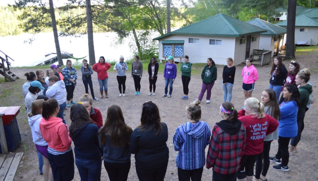 WeHaKee Camp for Girls Campers in a circle playing a game.
