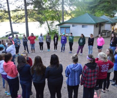 WeHaKee Camp for Girls Campers in a circle playing a game.