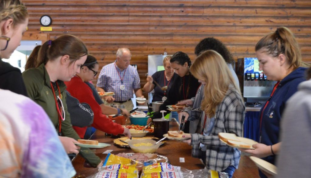 WeHaKee Camp for Girls staff members grabbing lunch from the buffet.