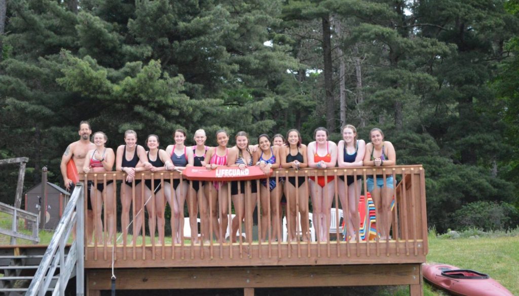 WeHaKee Camp for Girls group photo of lifeguard staff in swim gear.