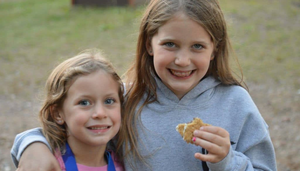 WeHaKee Camp for Girls campers enjoying smores.