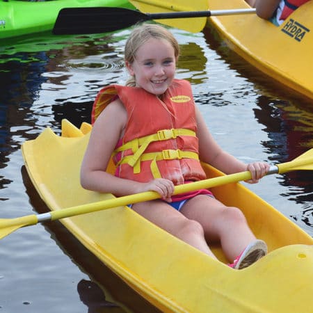 Camper kayaking down the river