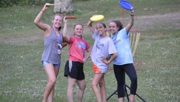 WeHakee Camp for Girls campers playing frisbee golf.