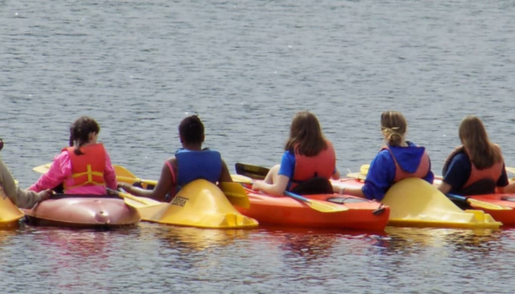 Campers Kayaking on the River at WeHaKee