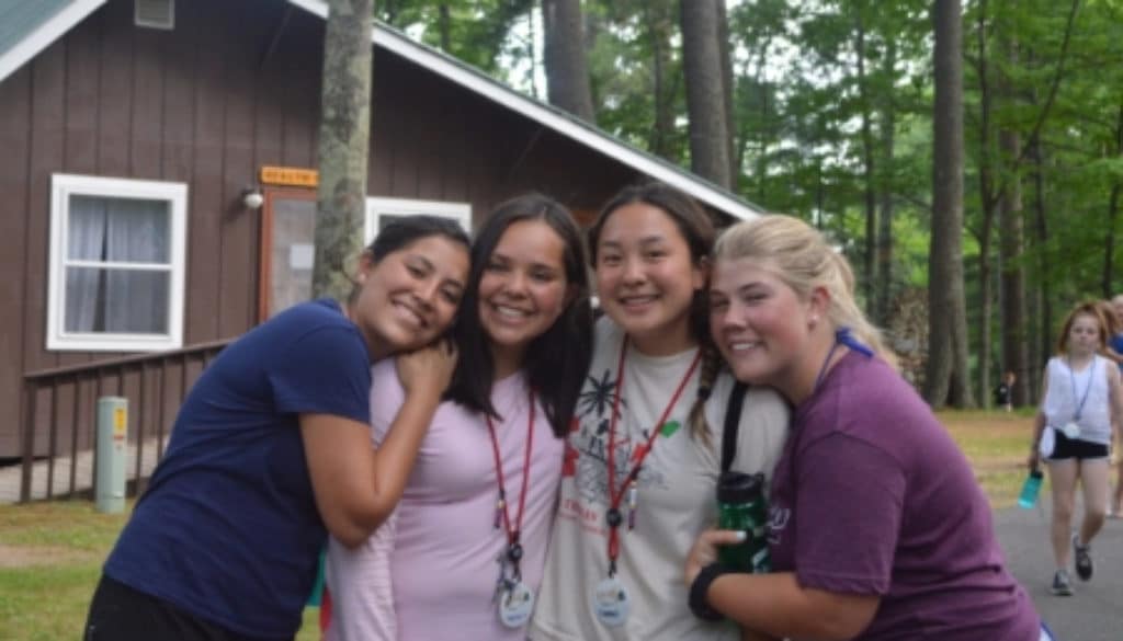 WeHakee Camp for Girls staff friends smiling in group photo.