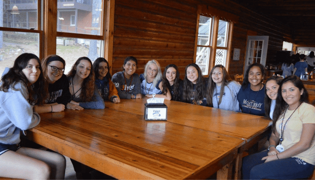 WeHaKee Camp for Girls Staff Sitting at a Table