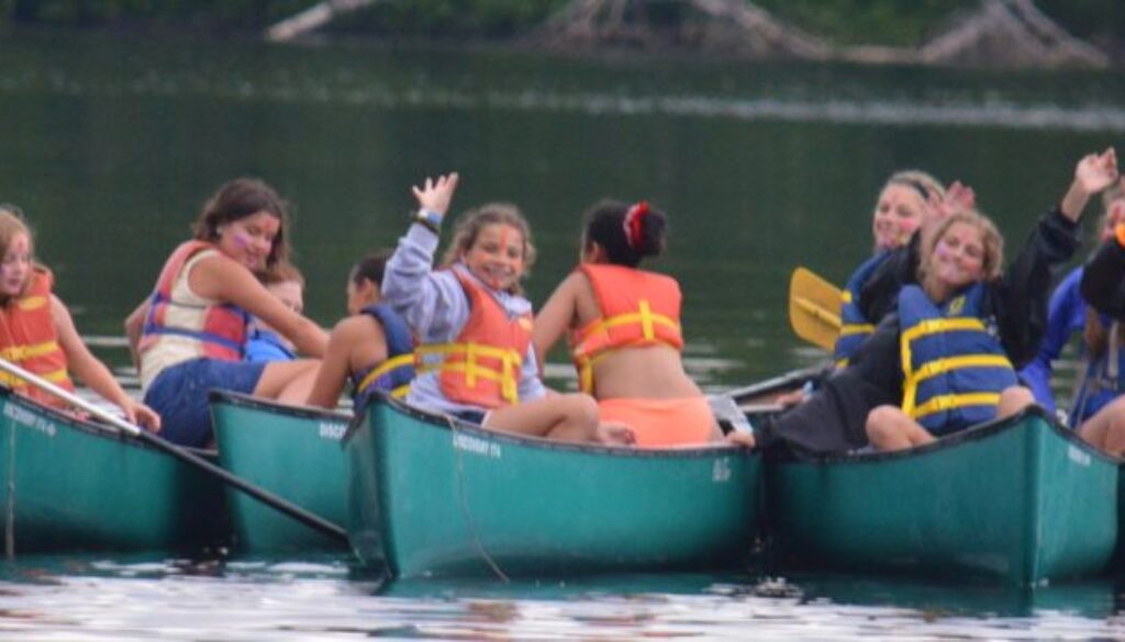 Campers canoeing on Hunter Lake at WeHaKee Camp for Girls