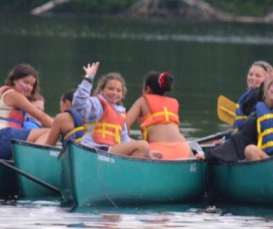 Campers canoeing on Hunter Lake at WeHaKee Camp for Girls