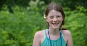 A happy camper at WeHaKee Camp For Girls.