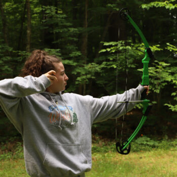 Camper practicing archery at WeHaKee Camp for Girls