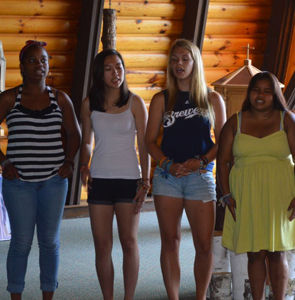 campers singing at WeHaKee chapel